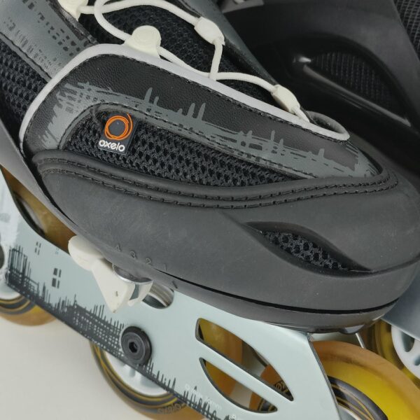 (37-40) Patins em linha ajustáveis Oxelo - Preto e branco