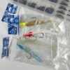 Lote Completo de Artigos de Pesca - Amostras, Anzóis, Vinis e Acessórios